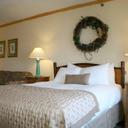 2631759 flat creek inn and suites guest room 1 def original sq128